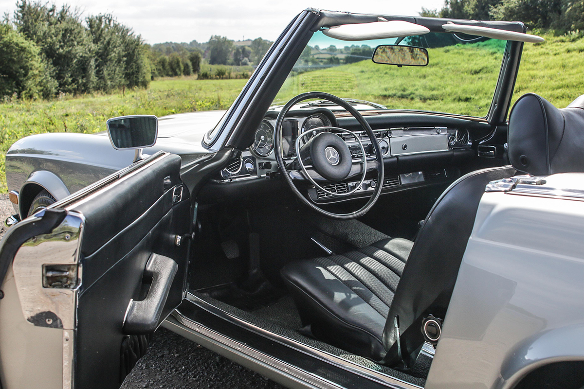 Interior of a 1970s Mercedes-Benz with black leather