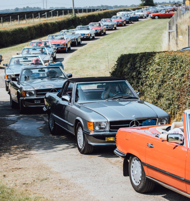 Convoy of Convertible Mercedes models at SLSHOP's 50th anniversary event.