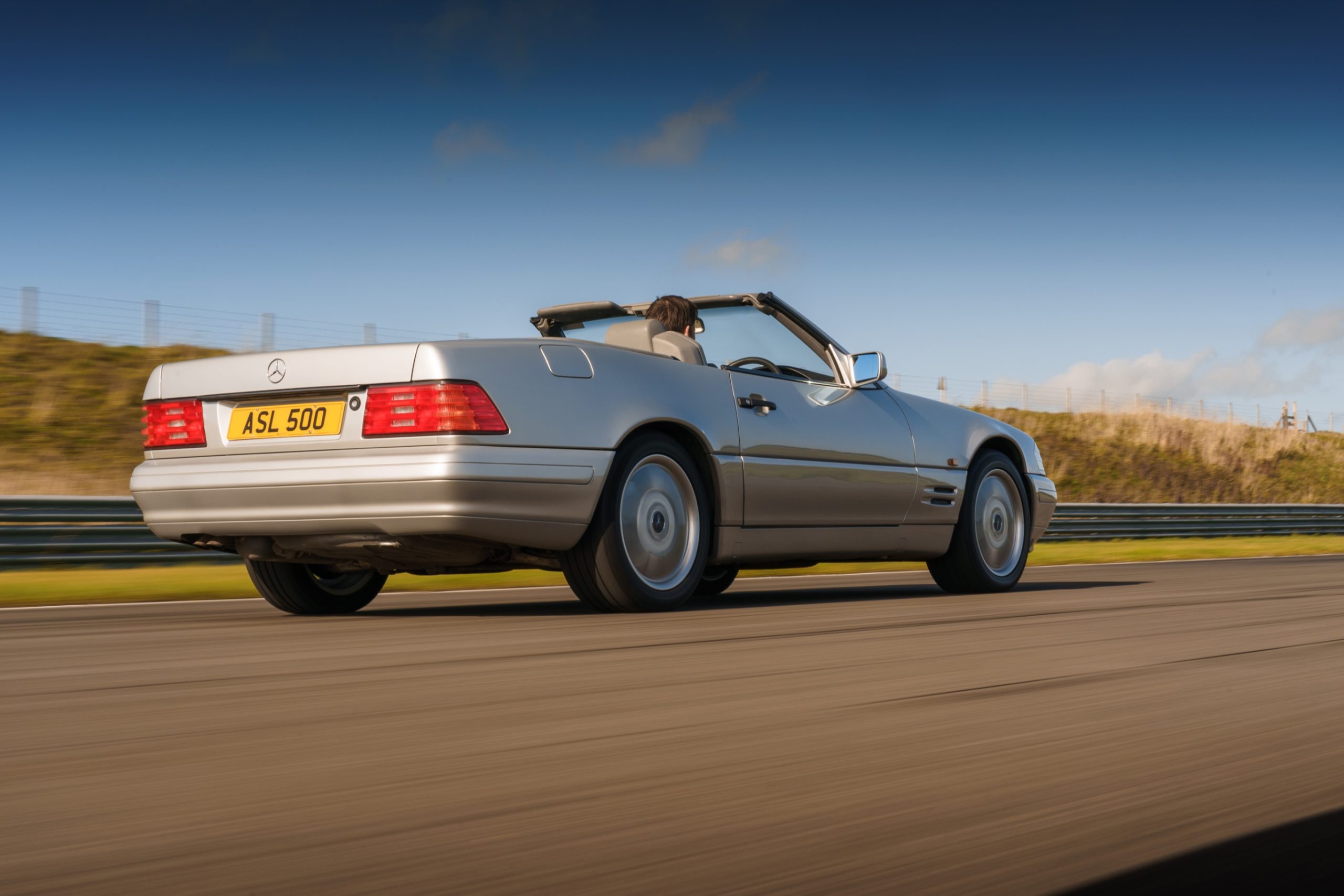 Rear three quarters of an R129 SL500.